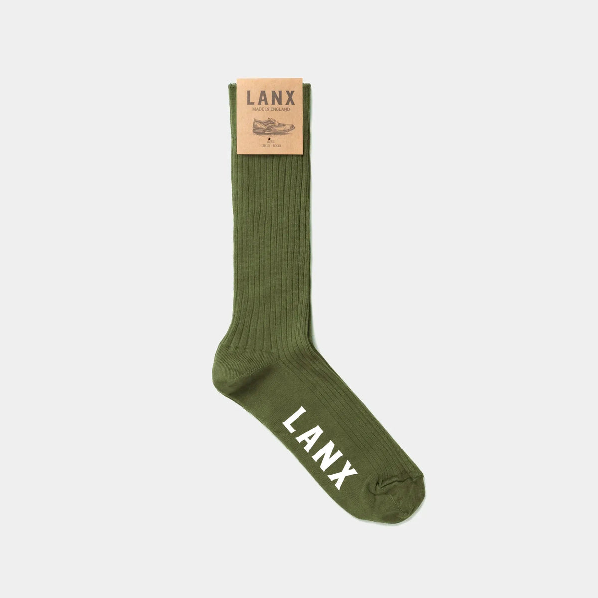 An olive green ribbed crew sock with 'LANX' printed in white on the toe and a tan paper brand tag at the cuff, shown against a light gray background.