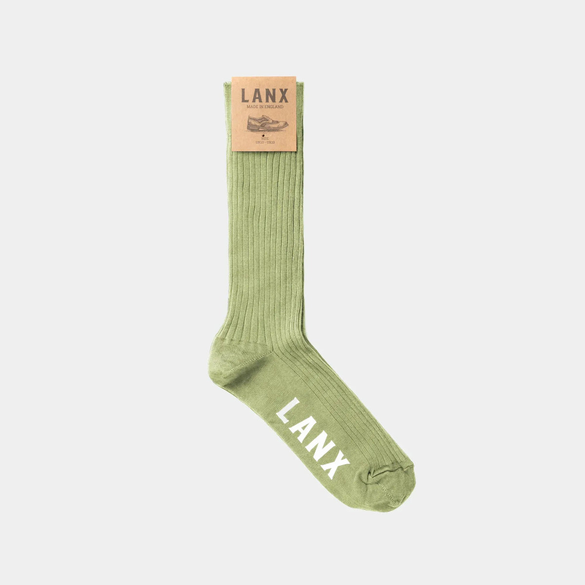 A single light olive green ribbed sock with 'LANX' printed in white on the toe, featuring a tan paper brand tag at the cuff, shown against a light gray background.
